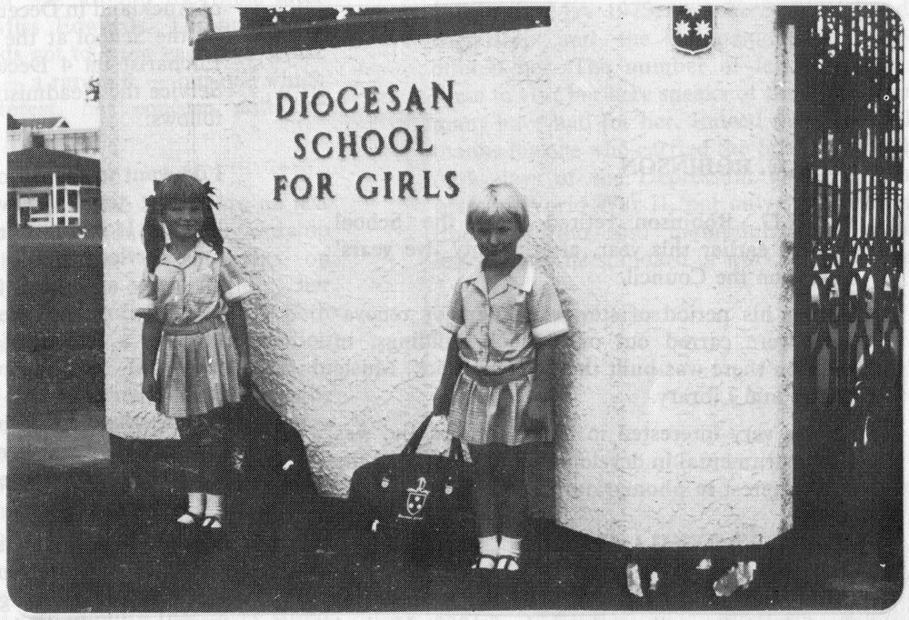 Standing next to the Dio sign