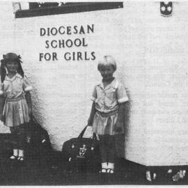 Standing next to the Dio sign